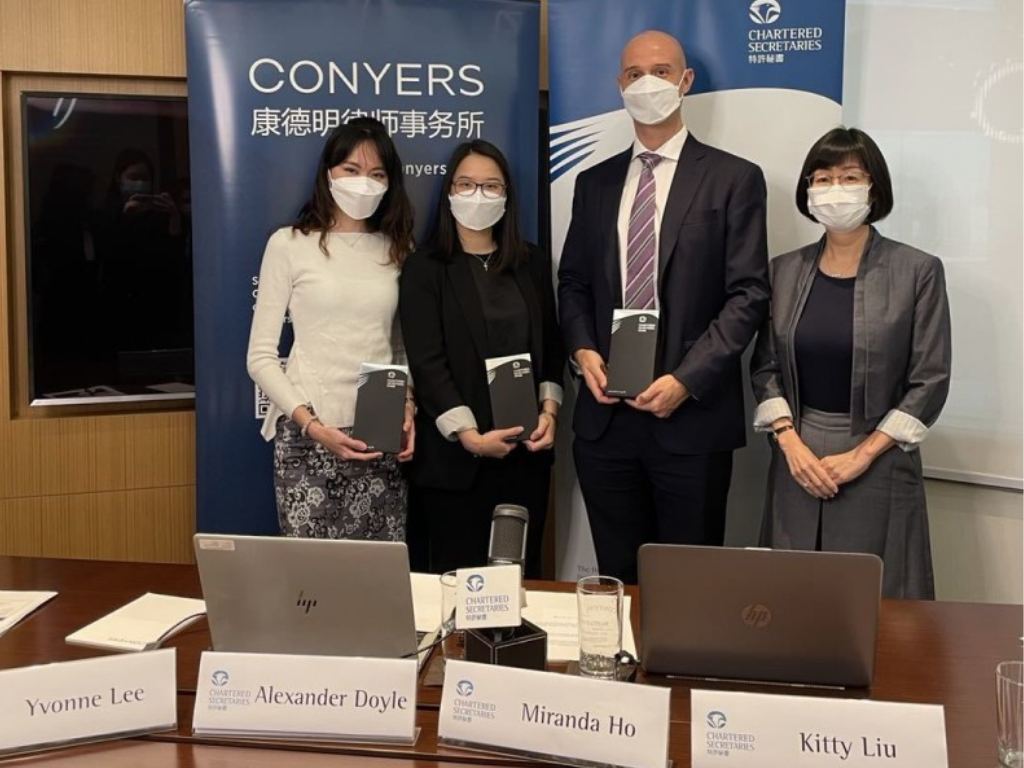 Photo of host and three speakers